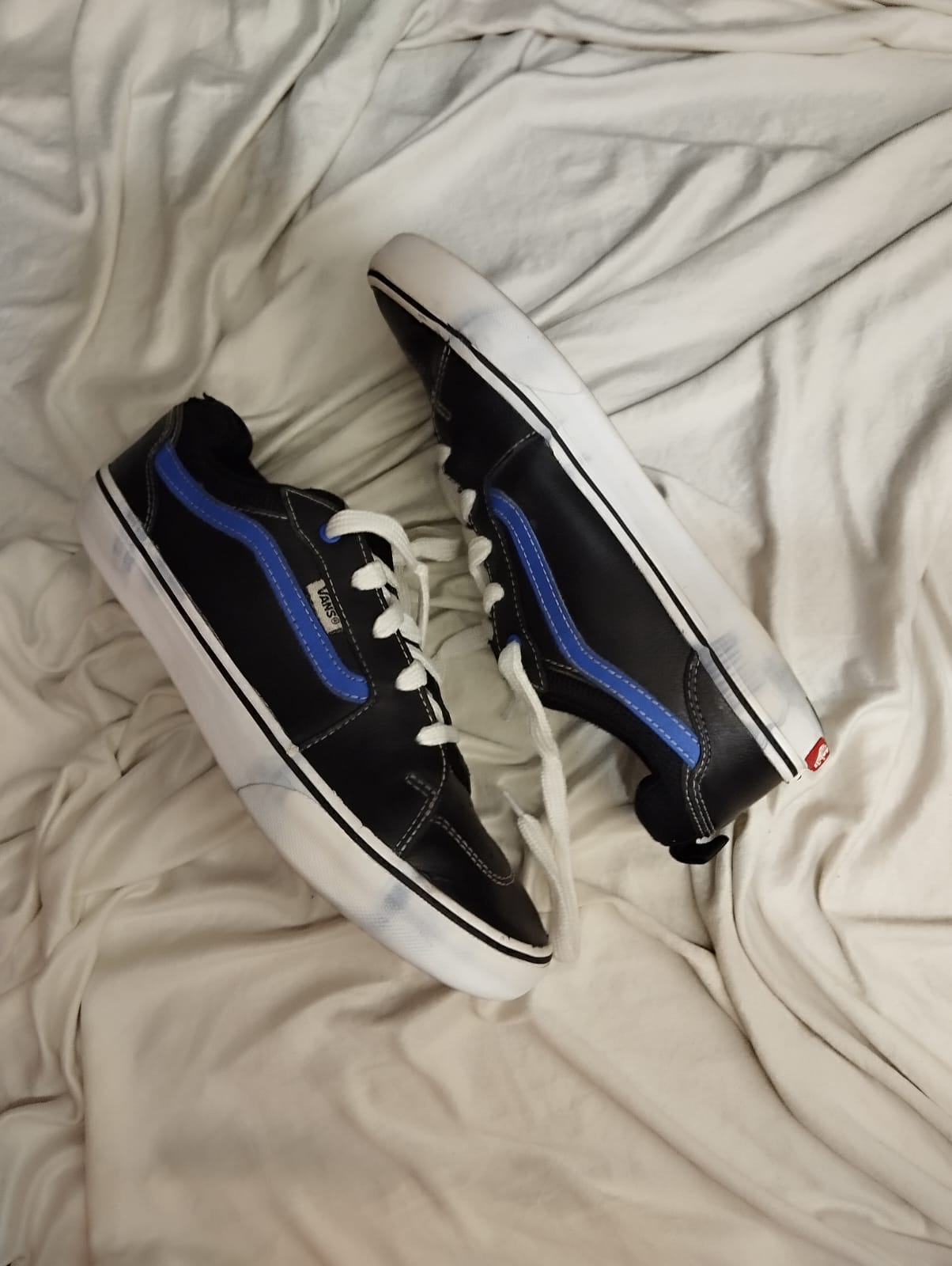 Black and blue low rise vans